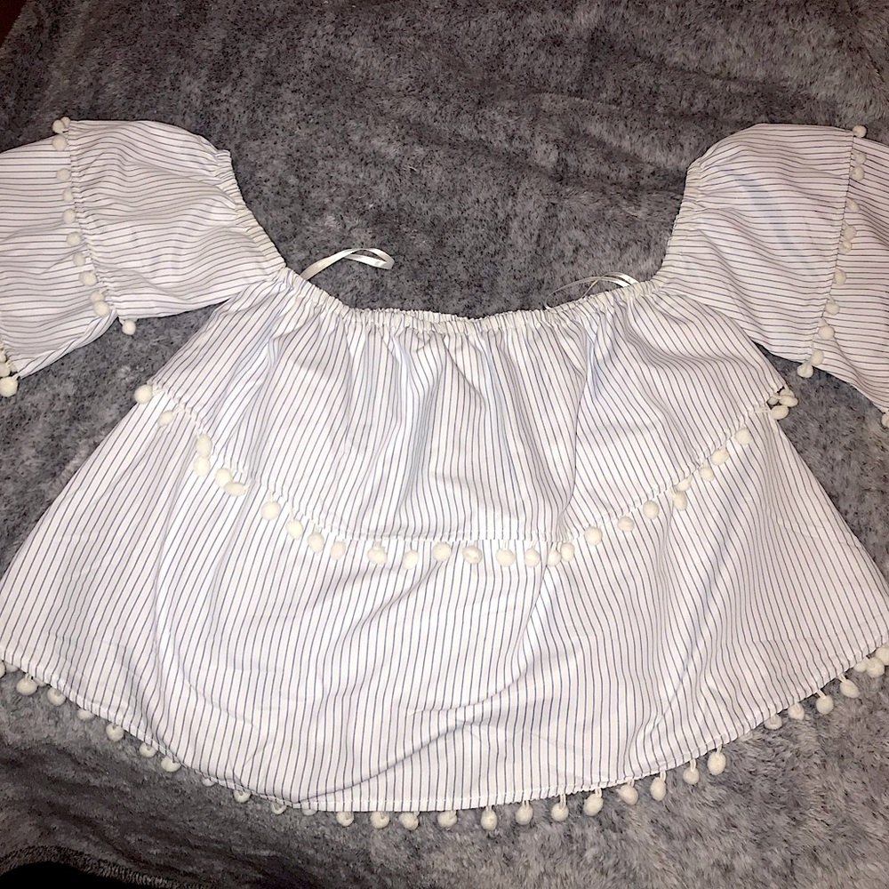 New never worn size large off the shoulder Pom Pom top